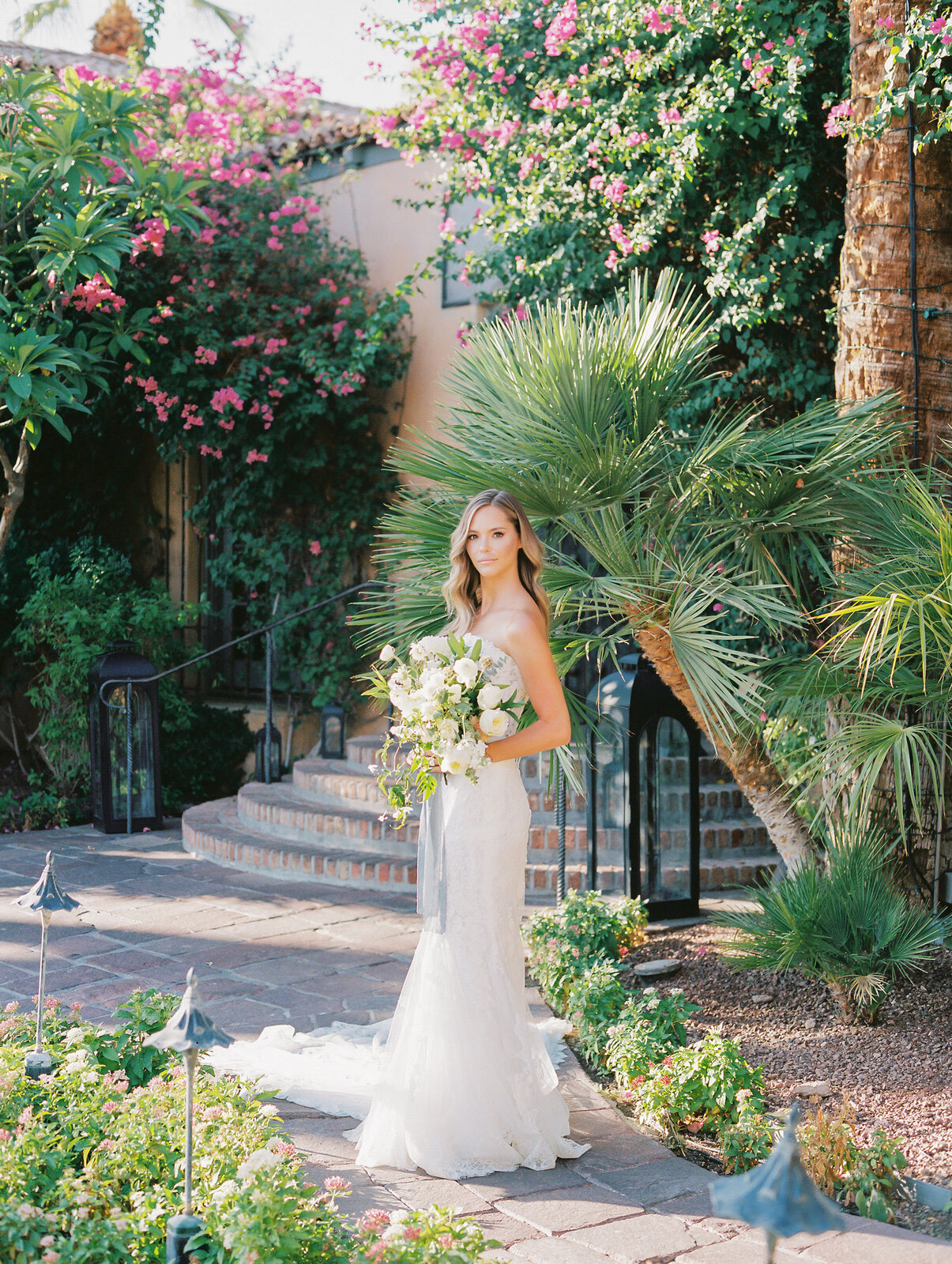 Editorial bridal portrait in a garden courtyard